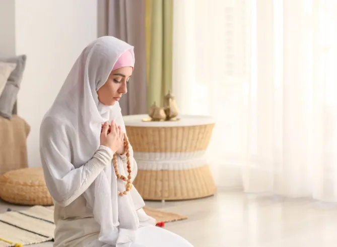 Muslim woman praying and offering gratitude