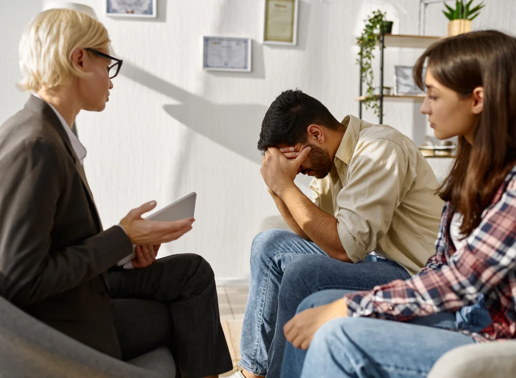 A therapist explaining emotions to a couple