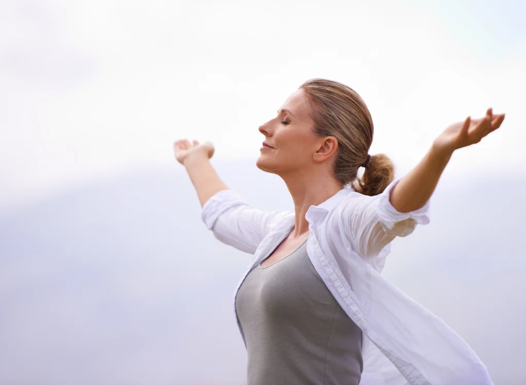 Woman regulating nervous system outdoors